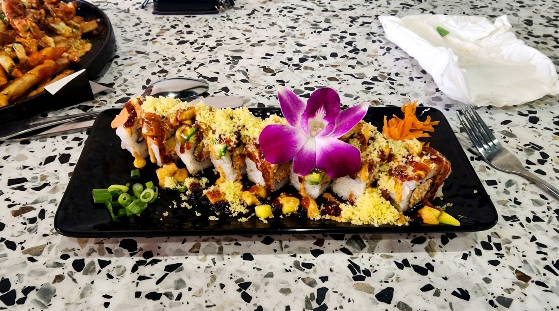 Sushi rolls and birria tacos